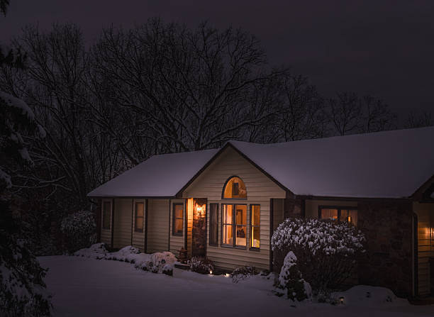 Cold winter night in Idaho Falls with cozy home being heated by a heat pump